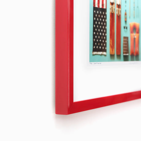 Ski and flag art in red frame at angle
